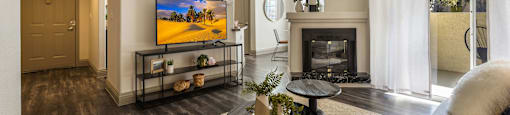 living room with fireplace and tv at Mirasol Apartments, Las Vegas, 89119