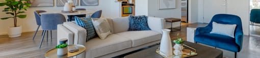 a living room with a couch and a table at The Rays at Vegas Towers Apartments, Las Vegas, 89119