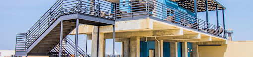 a building with stairs on top of it at South Side Flats, Dallas, Texas