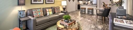 a living room with a couch and a table at South Side Flats, Dallas, TX, 75215