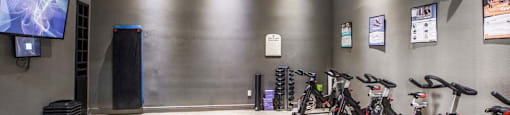 a room filled with bikes and a tv at Volare at the Woodlands, Texas, 77384