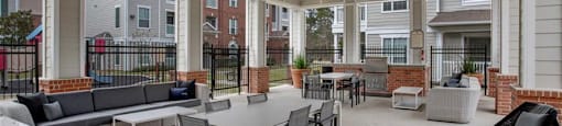 a large patio with tables and chairs at Volare at the Woodlands, The Woodlands, 77384