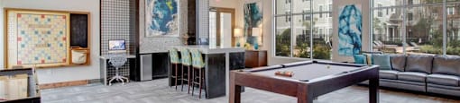 a large living room with a pool table at Volare at the Woodlands, The Woodlands, Texas