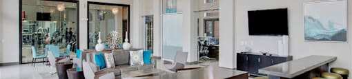 a large living room with a bar and a dining room at Volare at the Woodlands, The Woodlands, TX, 77384