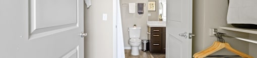 a room with a closet and a toilet and a bathroom at Ridge at Thornton Station Apartments, Thornton, CO 80229