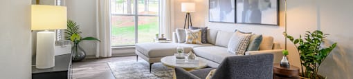 a living room with a couch and a chair at Ashford Green, Charlotte