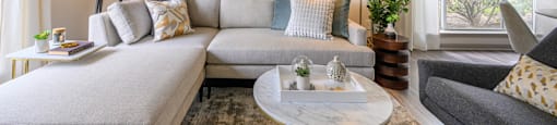 a living room with a couch and a coffee tableat Ashford Green, Charlotte, North Carolina 28262