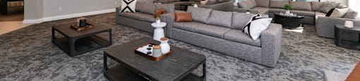 a large living room with couches and a coffee table  at Deerfield Village, Alpharetta, Georgia