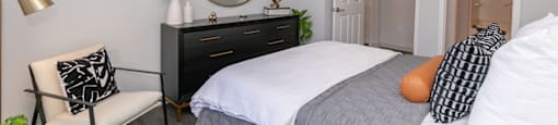 a bedroom with a bed and a ceiling fan at Deerfield Village, Alpharetta