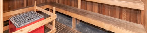 a wooden sauna with benches and a table at Deerfield Village, Alpharetta, GA