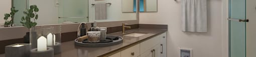 a bathroom with a sink and a mirror at Delphine on Diamond, California