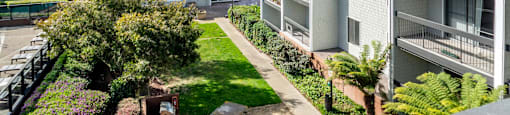 an aerial view of an apartment complex with a lawn and trees at Delphine on Diamond, San Francisco