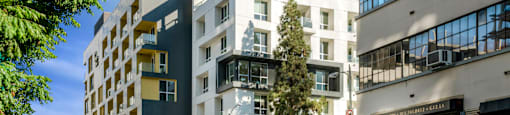 A city street with cars and buildings at G12 Apartments, Los Angeles, CA, 90015