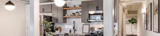 a kitchen and dining area in a loft at Highland Mill Lofts, Charlotte, North Carolina
