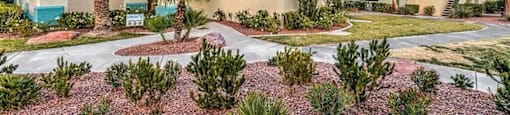 a house with a courtyard with plants and trees at Mirasol Apartments, Las Vegas, 89119