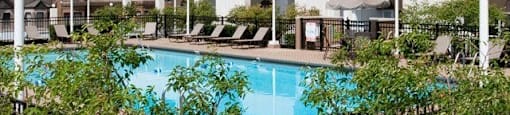 a large swimming pool in front of a building at The Montrose, Chicago, 60613