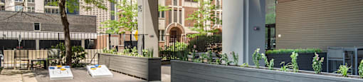 a communal area with benches and tables on a patio at North Harbor Tower, IL 60601