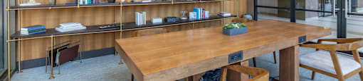 a conference room with a wooden table and shelves at North Harbor Tower, Chicago, IL