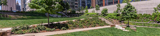 a park in the middle of a city with tall buildings at North Harbor Tower, Illinois