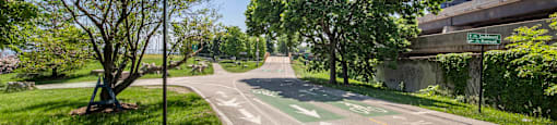 a bike path in a park next to a road at North Harbor Tower, IL 60601