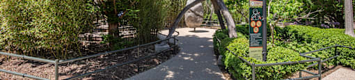 a park with trees and a sculpture in the middle at North Harbor Tower, Chicago, Illinois 60601