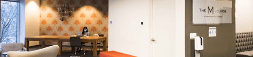 a room with couches and chairs and a table with a orange stool at Presidential Towers, Chicago, IL