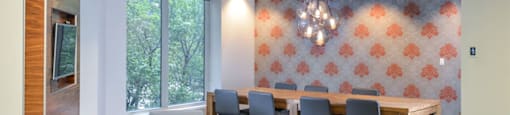 a conference room with a table and chairs and a large window at Presidential Towers, Chicago, 60661