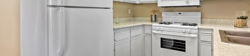 All-white kitchen at River Oaks in Oceanside, CA