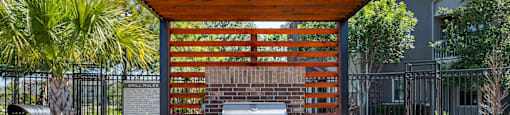 a patio with a grill and a table and chairs at Sladestone Shadow Creek, Pearland, TX, 77584