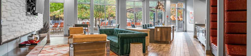 the lobby of a condo with a living room and a dining room at South Side Flats, Dallas, TX