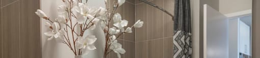 Renovated Bathrooms With Quartz Counters at The Elle Apartments, Chicago, Illinois