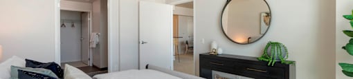a bedroom with a bed and a mirror above it  at Vue, San Pedro, 90731