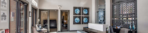 a lobby with a seating area and a reception desk at Volare at the Woodlands, The Woodlands, Texas