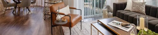 a living room with a couch and a table at Volare at the Woodlands, The Woodlands