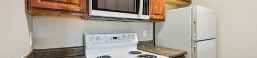 Kitchen with stove top oven at Sycamore Square Apartments, Mesa, 85202