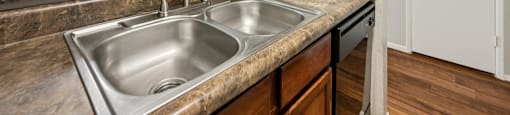Kitchen with sink at Sycamore Square Apartments, Mesa, Arizona