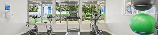 Gym with treadmills at Sycamore Square Apartments, Mesa, AZ