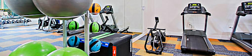 Gym with exercise equipment and a TV  at Aspire Thunderbird, Arizona