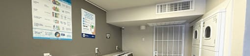 A row of washing machines in a public laundromat.