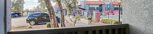 Balcony overlooks a street with cars and houses at Aspire Thunderbird, Glendale, AZ, Arizona, 85304