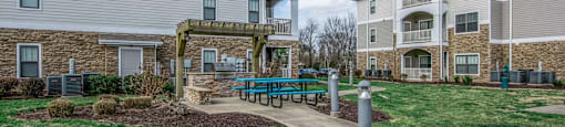 our apartments feature a spacious courtyard with a picnic table