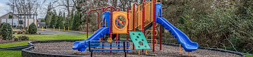 a playground in a park on a sunny day