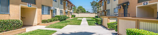 view of outside area between buildings at Serrano Apartments, West Covina, CA