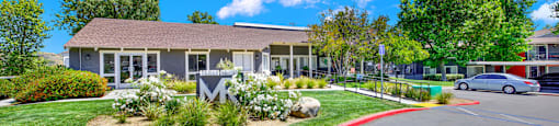 the front of a building with a car parked in front of it at Monterra Ridge Apartments, Canyon Country