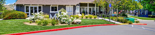 the front of a house with a driveway and a parking lot at Monterra Ridge Apartments, California,91351