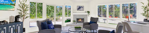 a living room with couches and chairs and a fireplace at Monterra Ridge Apartments, Canyon Country