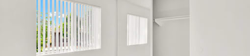 an empty room with a window and wood floors at Monterra Ridge Apartments, California,91351