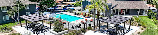 an aerial view of a backyard with a pool and picnic tables at Monterra Ridge Apartments, Canyon Country ,91351
