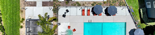 arial view of the pool and yard of a house with a blue pool at Monterra Ridge Apartments, Canyon Country ,91351