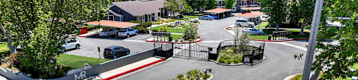 a view of a park with a playground and a parking lot at Monterra Ridge Apartments, California,91351